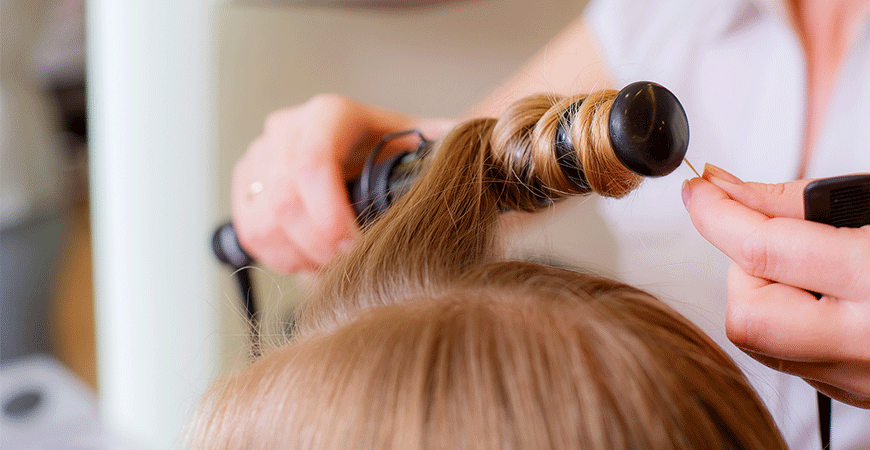 Hairdresser doing curls